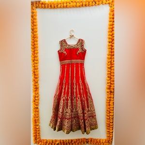 Red, net base, golden embroidery, stone work, heavy flaired Anarkali.